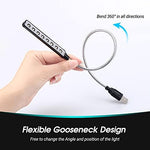 Daffodil eight LED travel light angled over a laptop keyboard trackpad