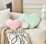 Soft faux fur heart shaped throw pillow close up