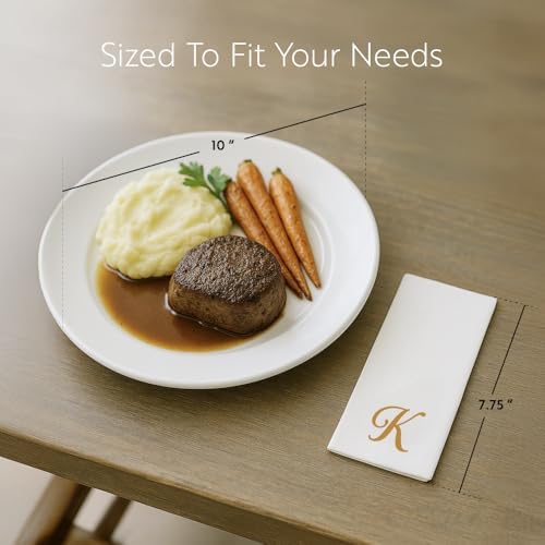 Close up of cursive gold letter K on white linen-feel napkin