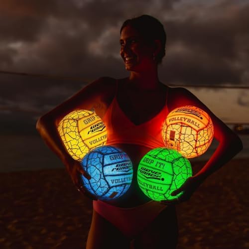 Wave Runner Grip It Volleyball being held by a player near a beach court.