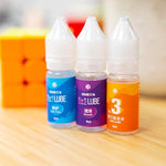 Three pieces of ten milliliter professional cubing lubricants lined up