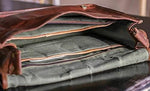 Cuero handmade leather satchel brass hardware and strap detail