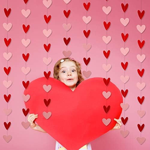 Romantic photo booth background created with multiple strands of heart banners