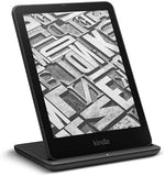 Kindle Paperwhite resting on Anker wireless charging stand