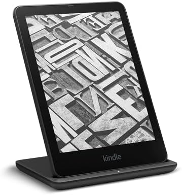 Kindle Paperwhite resting on Anker wireless charging stand