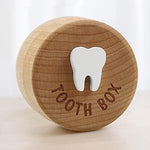 Close up of 3D carved tooth icon on wooden box lid