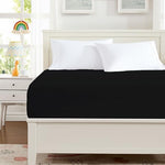 King size bed with Hotella black fitted sheet