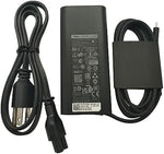 Dell sixty-five watt type c power supply showing the rubber management strap and connector tip close up