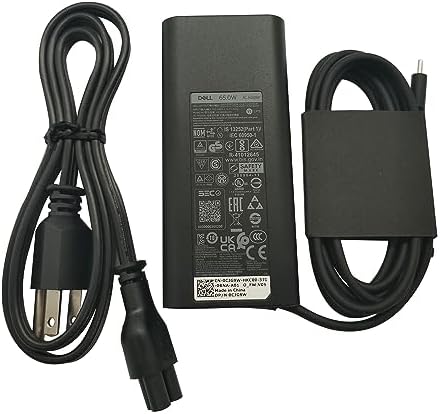 Dell sixty-five watt type c power supply showing the rubber management strap and connector tip close up