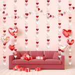 Thick cardstock double sided glitter heart banner suspended from a ceiling