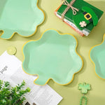 Top down view of mint green shamrock shaped party plates