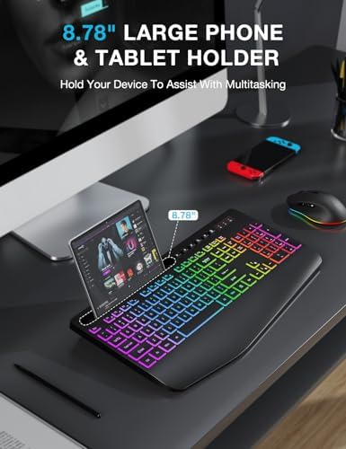 SABLUTE six button wireless mouse with adjustable dots per inch control next to the sleek black keyboard.