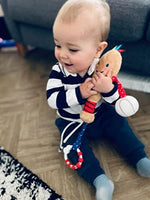 Soft plush baby sports toy set displayed on a clean nursery play mat.