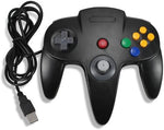 Black classic retro sixty-four bit computer gamepad highlighting the analog joystick and directional pad