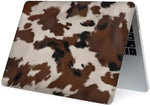 Generic cowhide print laptop cover bottom shell view displaying cooling vents