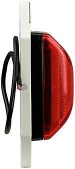 A detailed view of the two and three quarter inch center mounting holes on the Blazer International vehicle light.