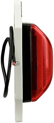 A detailed view of the two and three quarter inch center mounting holes on the Blazer International vehicle light.
