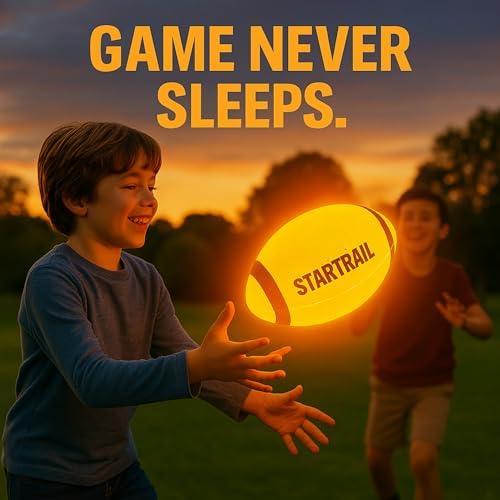 TOMLEON light up football for night games being caught during evening backyard play