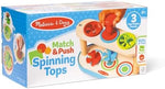 Close up of Melissa and Doug Match and Push Spinning Tops plunger mechanism