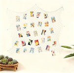 Patioland eighty by forty inch cotton netting draped as a beach theme room ceiling accent