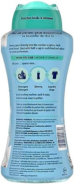 Close up of Downy laundry beads highlighting the Cool Cotton scent and antioxidant technology.