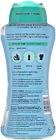 Close up of Downy laundry beads highlighting the Cool Cotton scent and antioxidant technology.