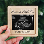 Hangwoous baby coming soon announcement frame held in hands for reveal