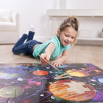 Melissa And Doug outer space jigsaw puzzle pieces scattered on the floor highlighting the oversized jumbo thickness.