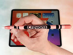Apple Pencil Pro featuring the POP SKIN orange pink crayon design skin attached to an iPad