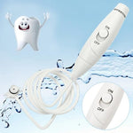 Top view of water flosser handle showing water flow control button