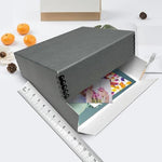 Lineco archival storage box holding assorted paper documents
