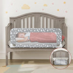NUTIKAS toddler bed rails convertible safety side protector attached to a wooden crib frame.
