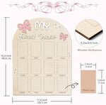 Rustic wooden 12 month baby picture display with pink bow accents