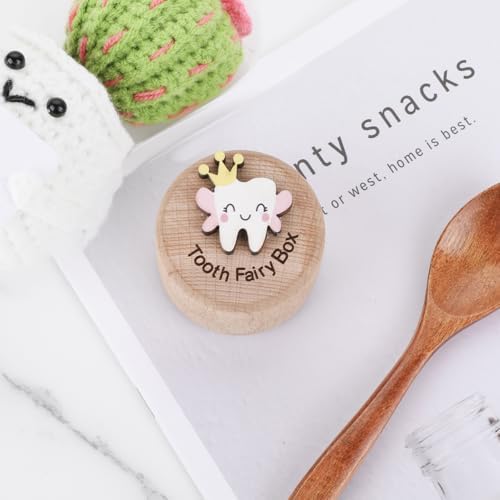 Child holding decorative wooden tooth storage container