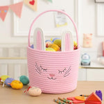 Handwoven pink rabbit rope basket showing embroidered face and handle detailing