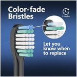 Comparison of new and faded blue reminder bristles on toothbrush head