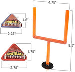 Orange plastic miniature football goal posts with suction cups attached to an office desk.