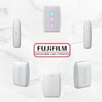 Clay White Instax Mini Link 3 device printing a vivid two by three inch smartphone photo.