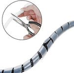 Demonstration of cutting the translucent 1/4 inch spiral wire wrap cord with household scissors.