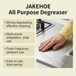 Simple Green quick stain removal spray being applied to grease on kitchen cabinets and countertops