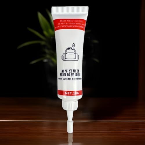 High viscosity synthetic lubricant reducing friction on vehicle caliper piston contact points.