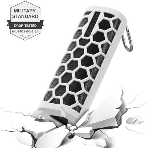 Grey silicone sleeve protector for wireless Bluetooth speaker with attached metal carabiner.