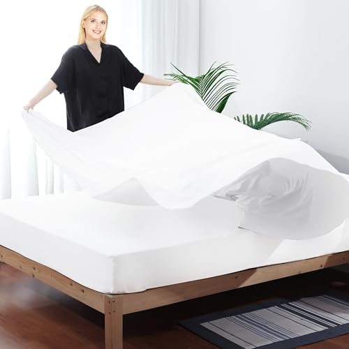 Oversized white King size flat sheet showing ample fabric length for tight tucking