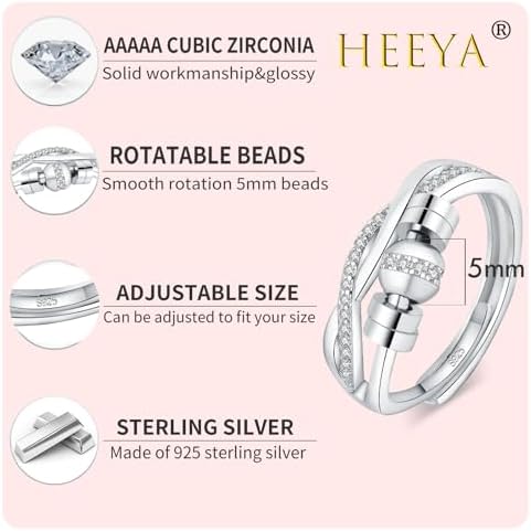 Adjustable sterling silver fidget ring with moveable ball beads for stress relief on a model's thumb.