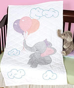 Close up view of the printed elephant pattern guidelines on the white cotton polyester embroidery quilt top.