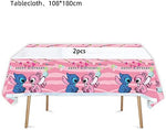 Losede rectangular pink plastic table cover spread over a birthday party table setup