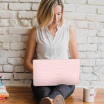 Bubble free installation process of a pink polka dot laptop decal protector