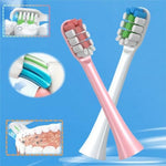 Individually sealed pink electric toothbrush heads with dust covers