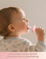 Pink silicone baby toothbrush inside its transparent travel storage case.