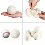 Natural white wool dryer balls loaded into a tumble machine to prevent clothing tangles and reduce wrinkling.